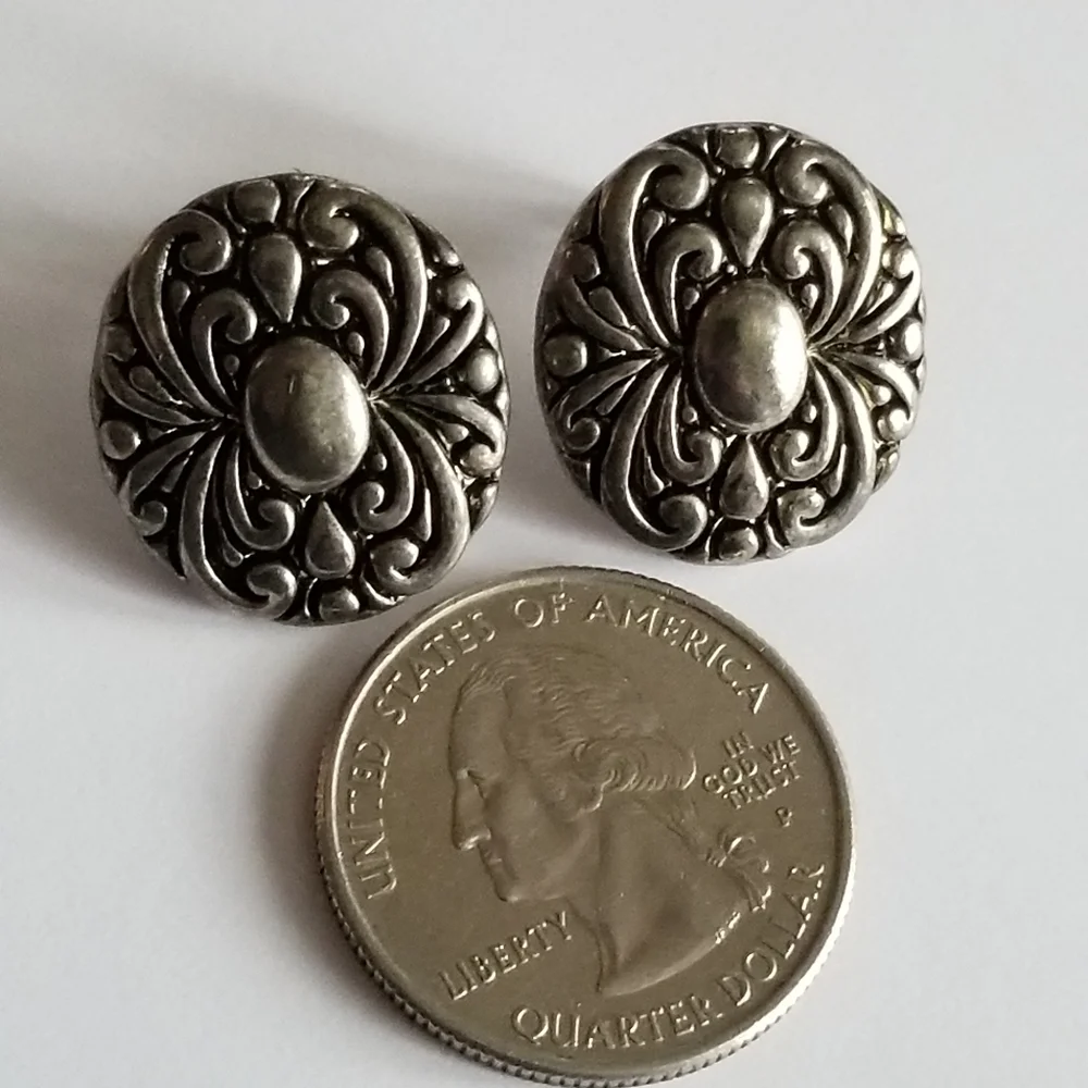Earrings Silver tone earrings oval stud scrolled design